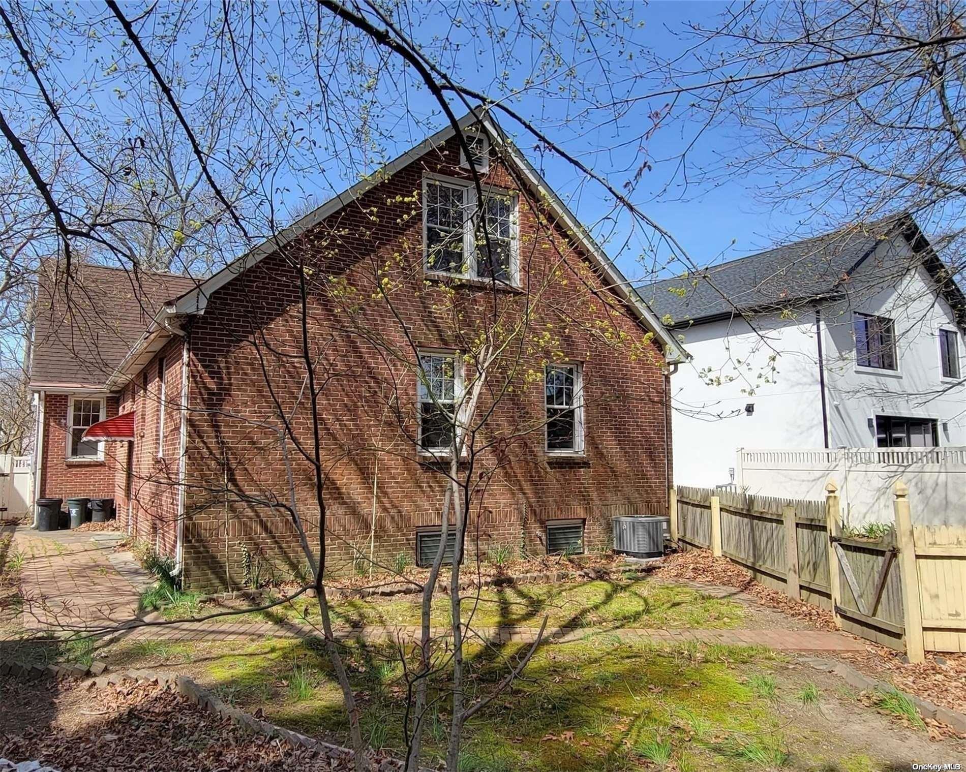 138 Hewlett Avenue Merrick, NY 11566 - Photo 32 of 35 a view of a house with a snow on the wall