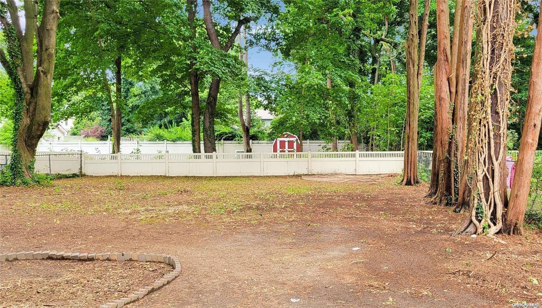 138 Hewlett Avenue Merrick, NY 11566 - Photo 34 of 35 a view of a swimming pool with an outdoor space and seating area