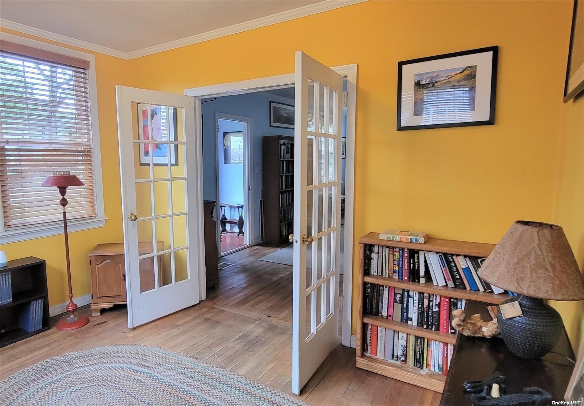 138 Hewlett Avenue Merrick, NY 11566 - Photo 7 of 35 a view of a bedroom with furniture and book shelf
