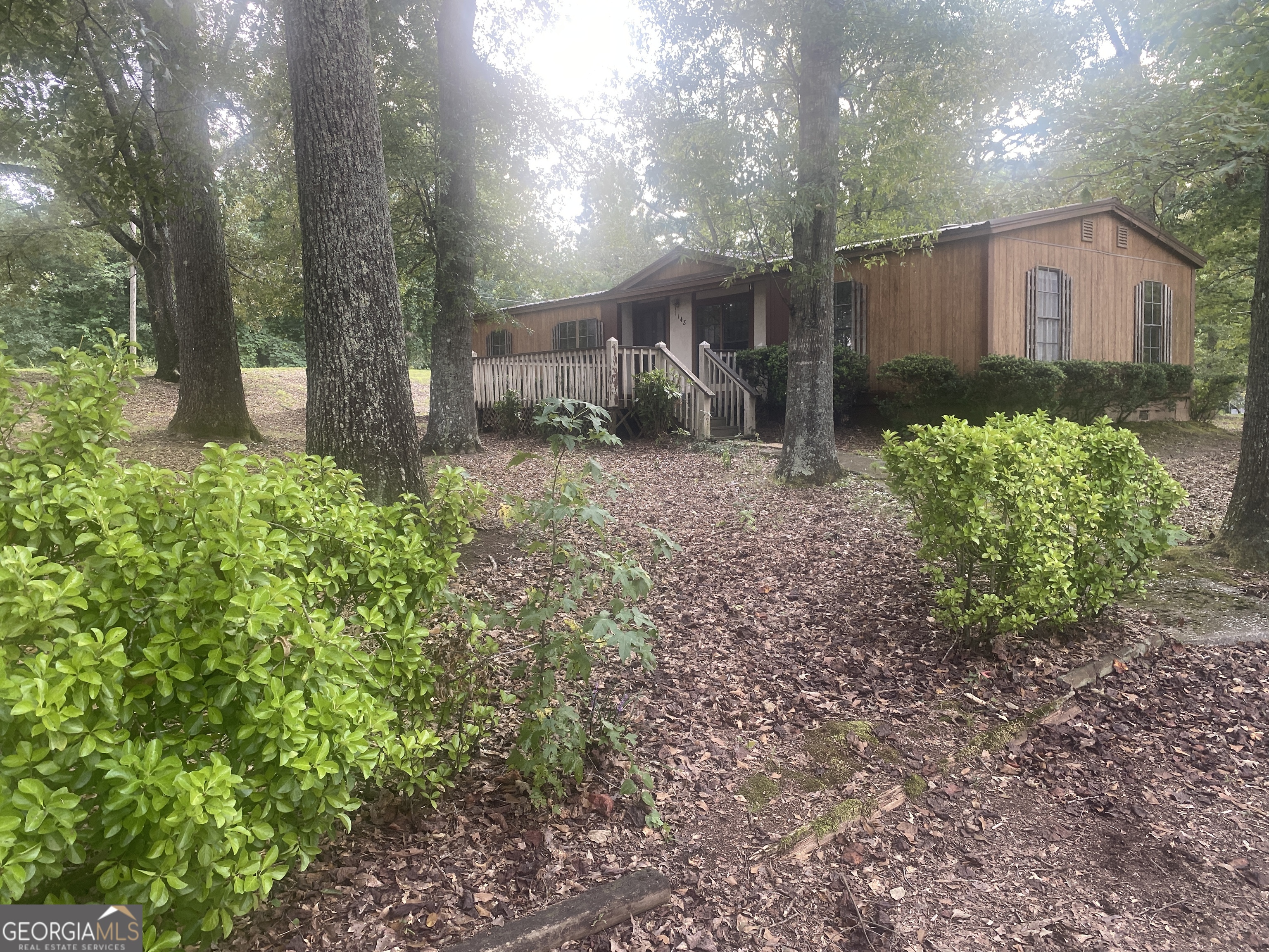 1156 North Van Wert Road Villa Rica, GA 30180 - Photo 1 of 1 a front view of a house with garden