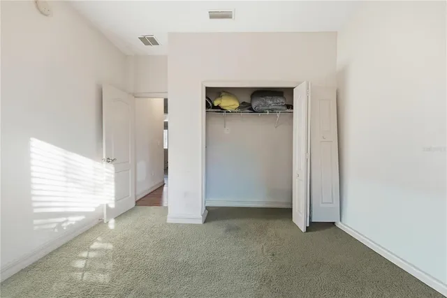 a view of an empty room with a fireplace