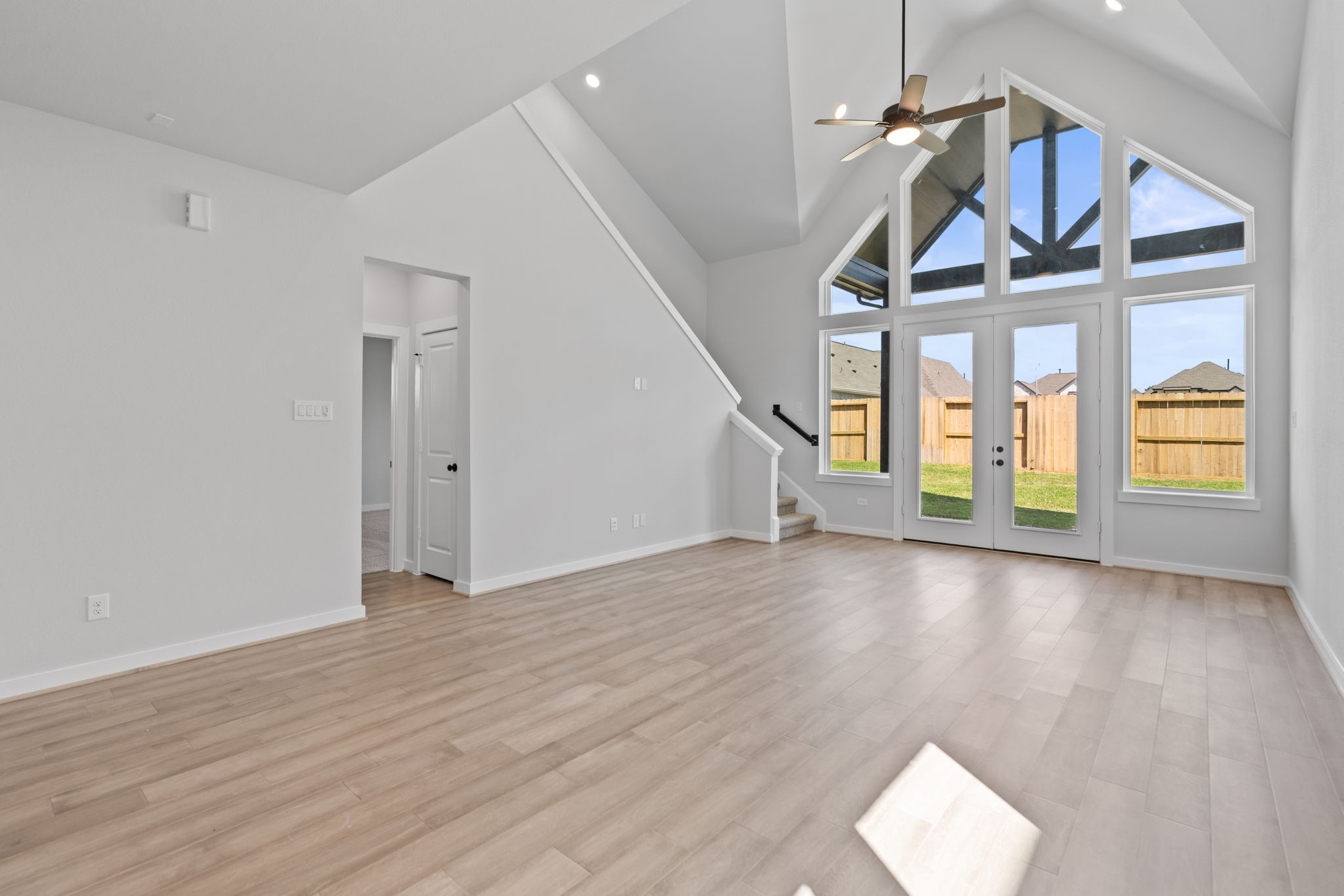 10919 Middle Rdg Drive Missouri City, TX 77459 - Photo 11 of 43 wooden floor in an empty room with a window