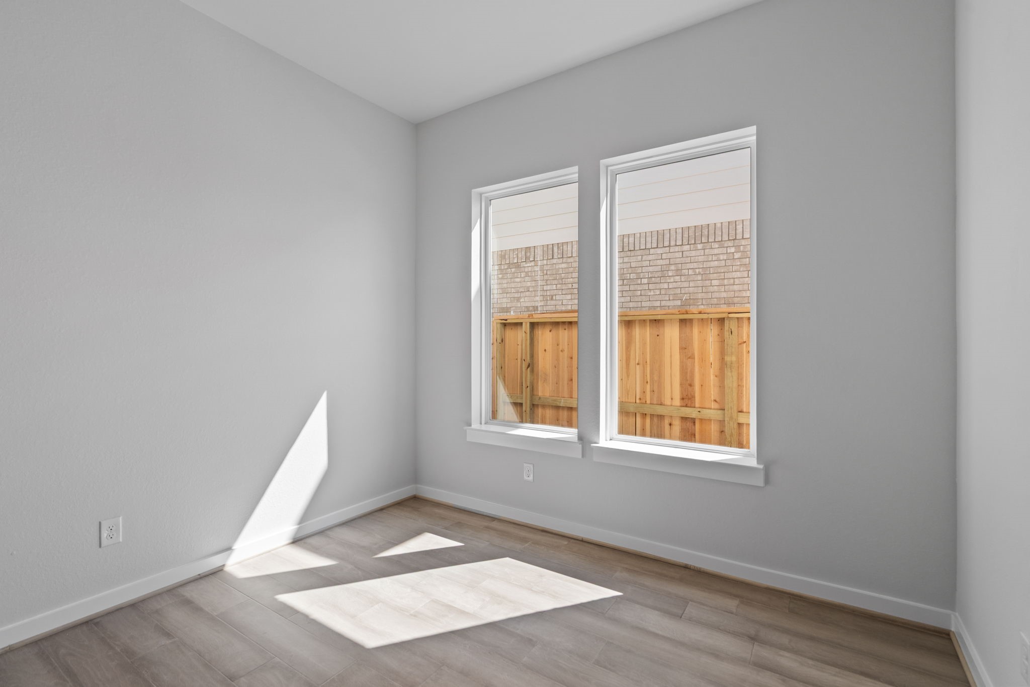 10919 Middle Rdg Drive Missouri City, TX 77459 - Photo 18 of 43 a view of an empty room with wooden floor and a window