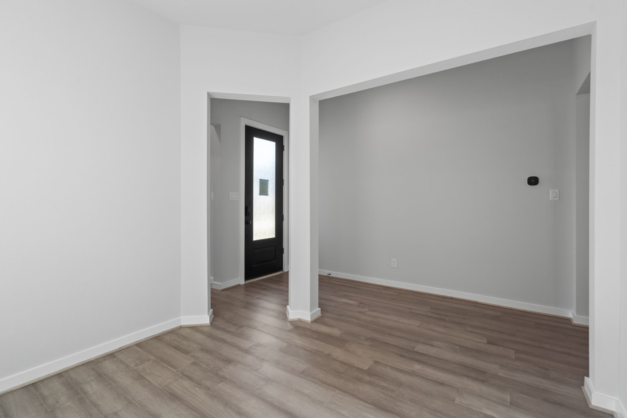 10919 Middle Rdg Drive Missouri City, TX 77459 - Photo 6 of 43 a view of an empty room with wooden floor
