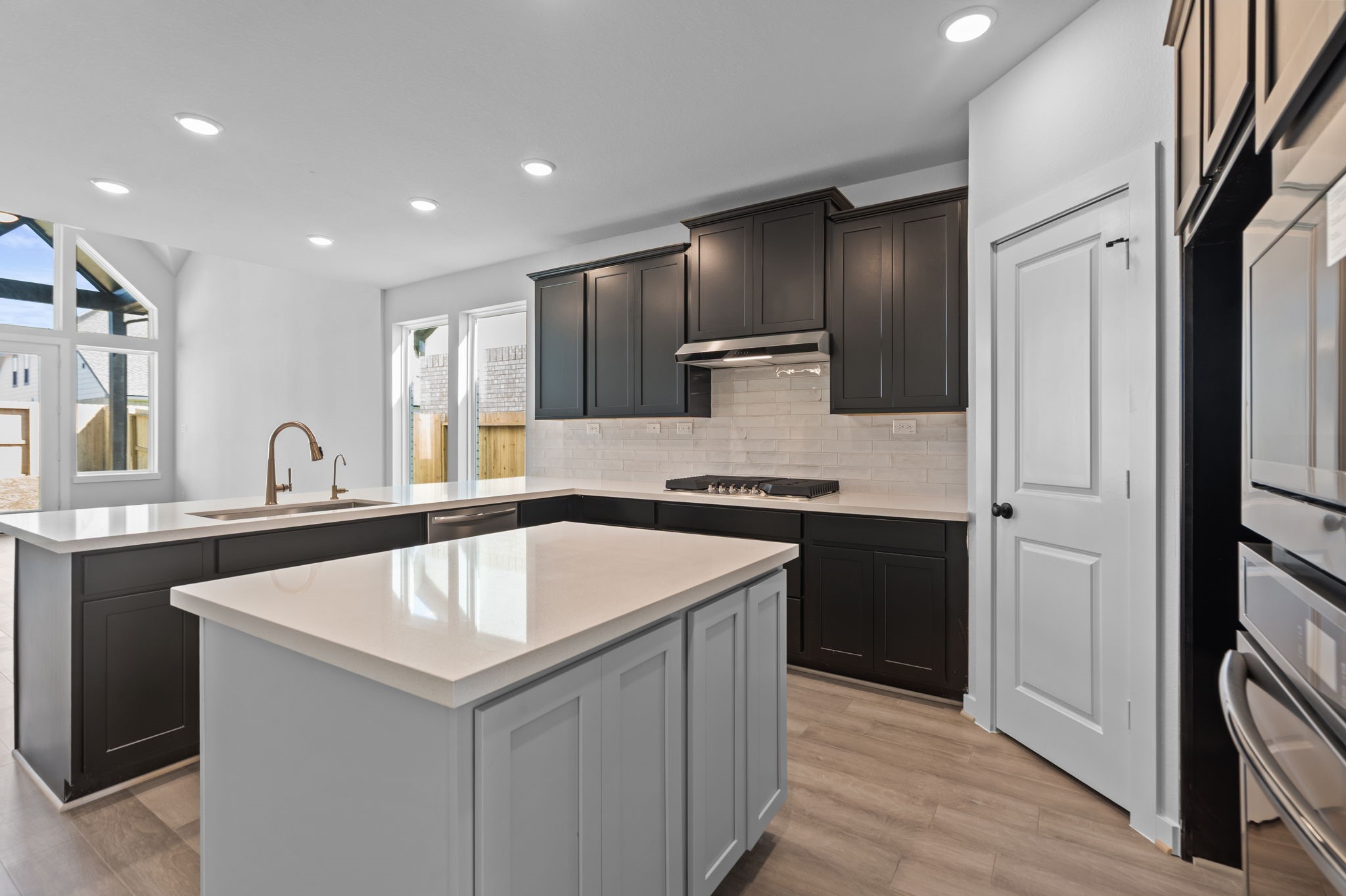 10919 Middle Rdg Drive Missouri City, TX 77459 - Photo 8 of 43 a kitchen with a sink cabinets and stainless steel appliances