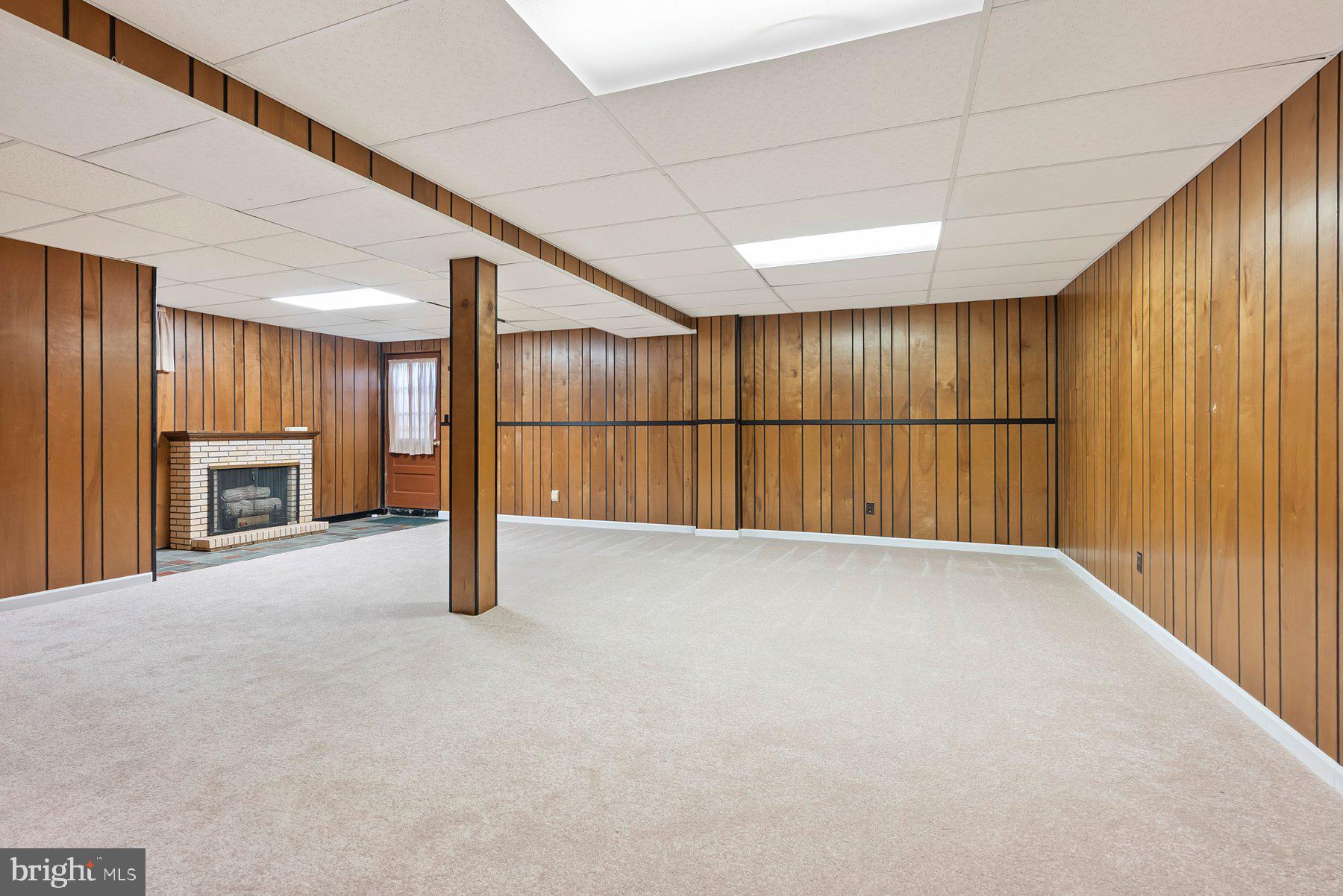 8301 Overmont Road Baltimore, MD 21234 - Photo 22 of 28 a view of an empty room with a fireplace