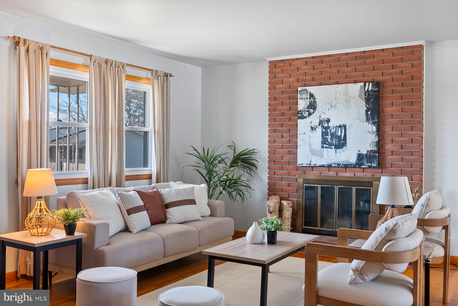 8301 Overmont Road Baltimore, MD 21234 - Photo 5 of 28 a living room with furniture and a fireplace