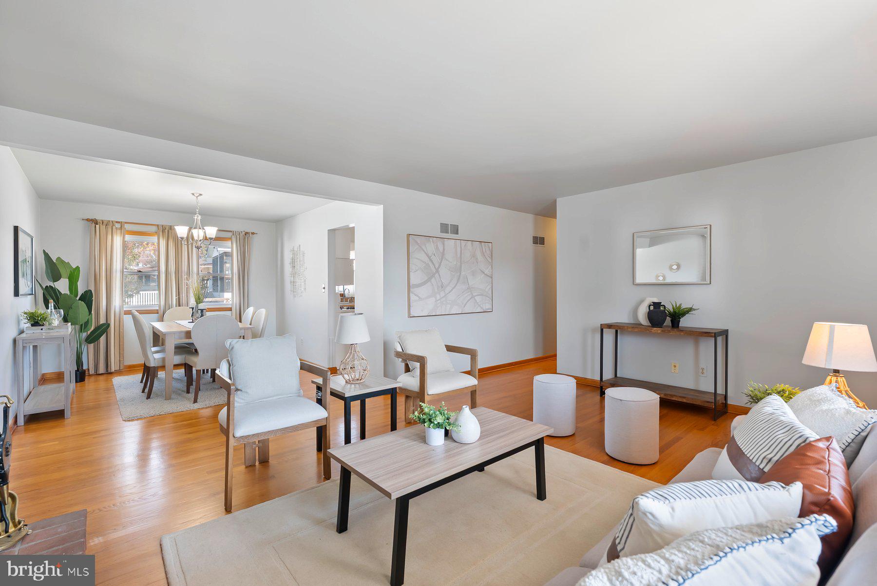 8301 Overmont Road Baltimore, MD 21234 - Photo 6 of 28 a living room with furniture a wooden floor and a table