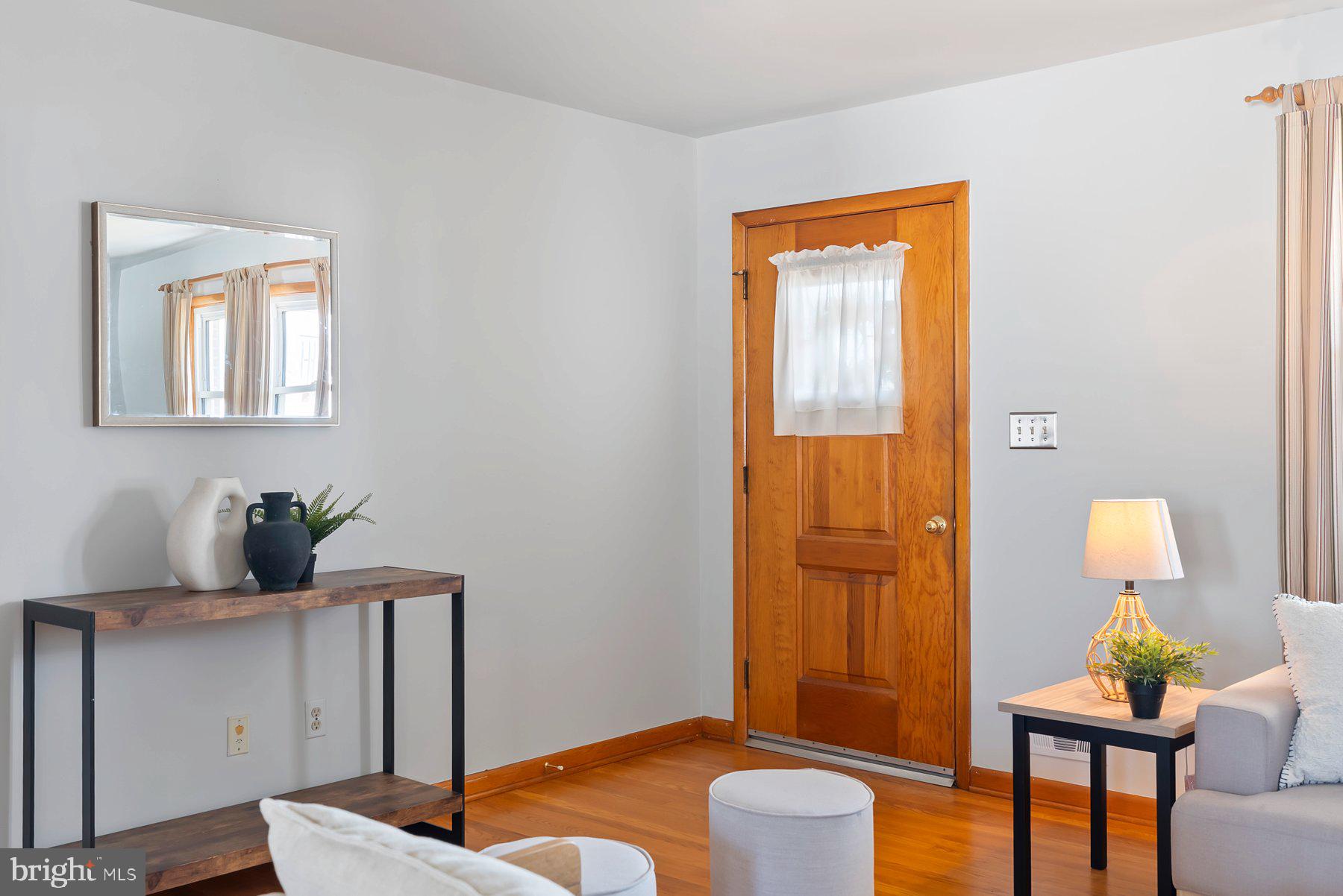8301 Overmont Road Baltimore, MD 21234 - Photo 7 of 28 a living room with furniture and a window