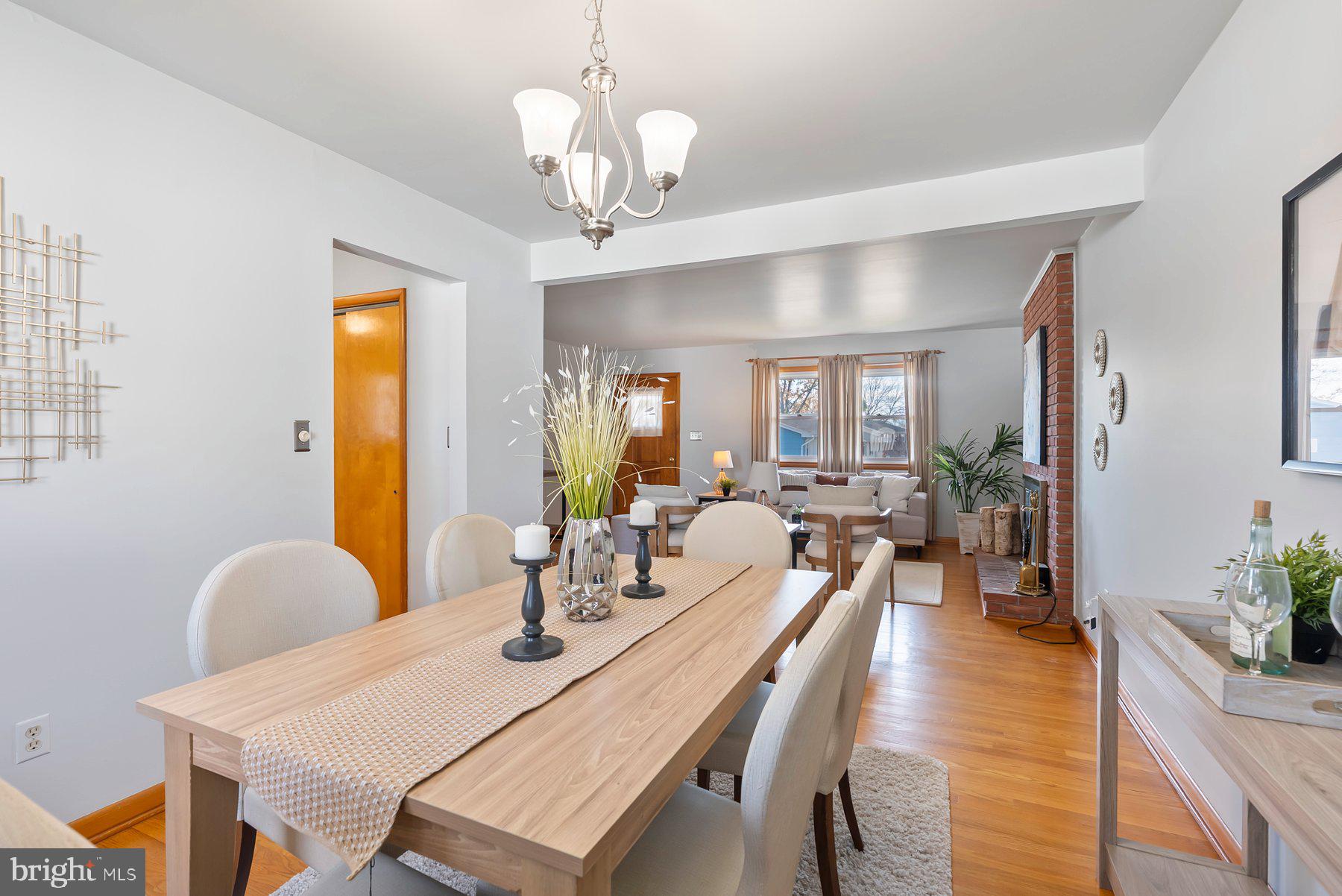 8301 Overmont Road Baltimore, MD 21234 - Photo 9 of 28 a view of a dining room with furniture and wooden floor