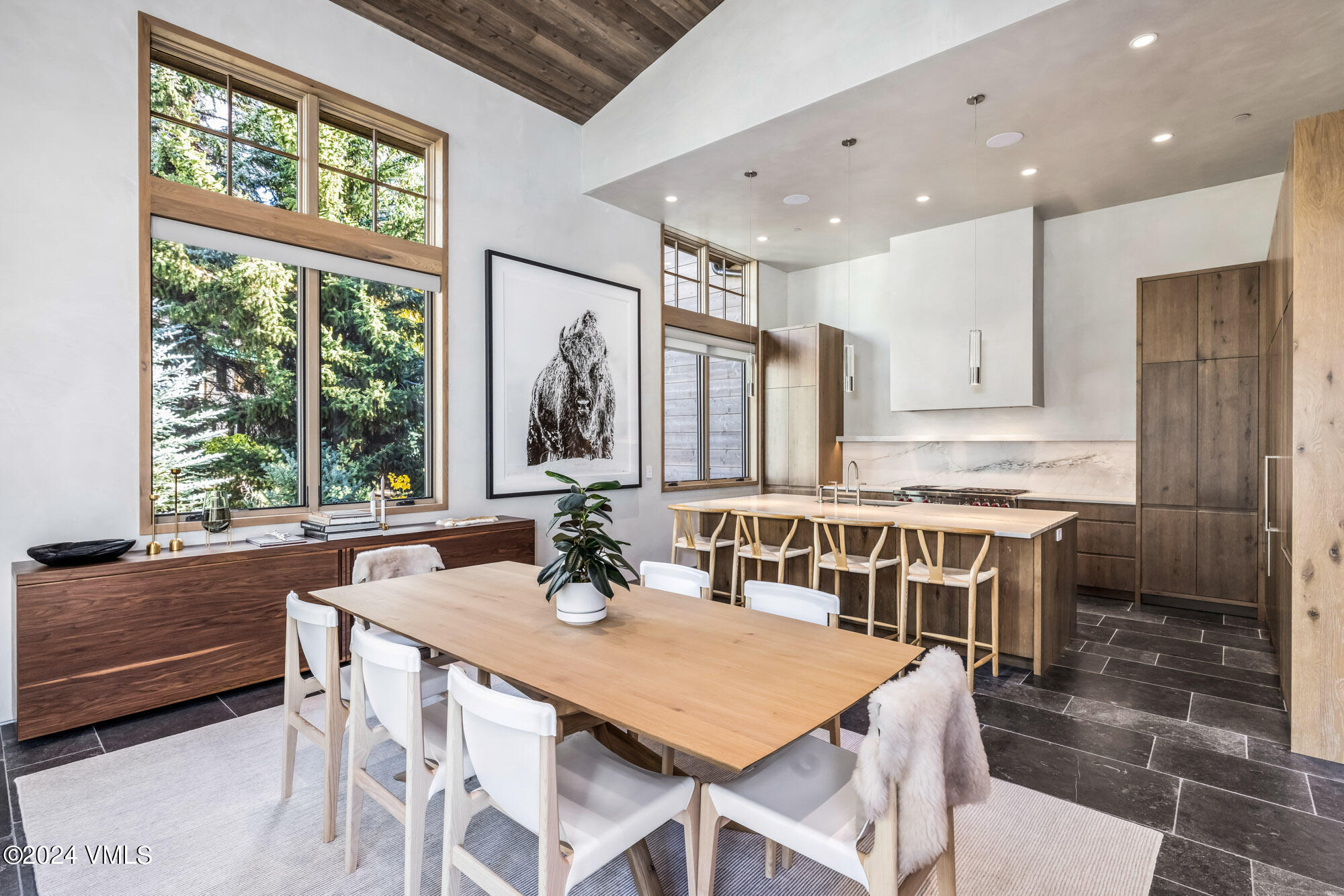 1022 Eagles Nest Circle Vail, CO 81657 - Photo 12 of 41 a kitchen with a table chairs sink and cabinets