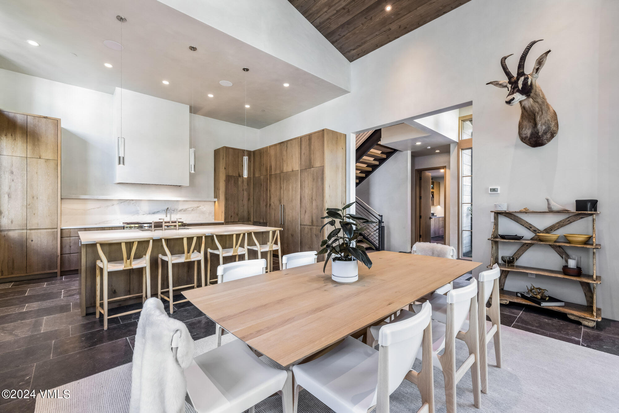 1022 Eagles Nest Circle Vail, CO 81657 - Photo 13 of 41 a dining room with furniture and wooden floor