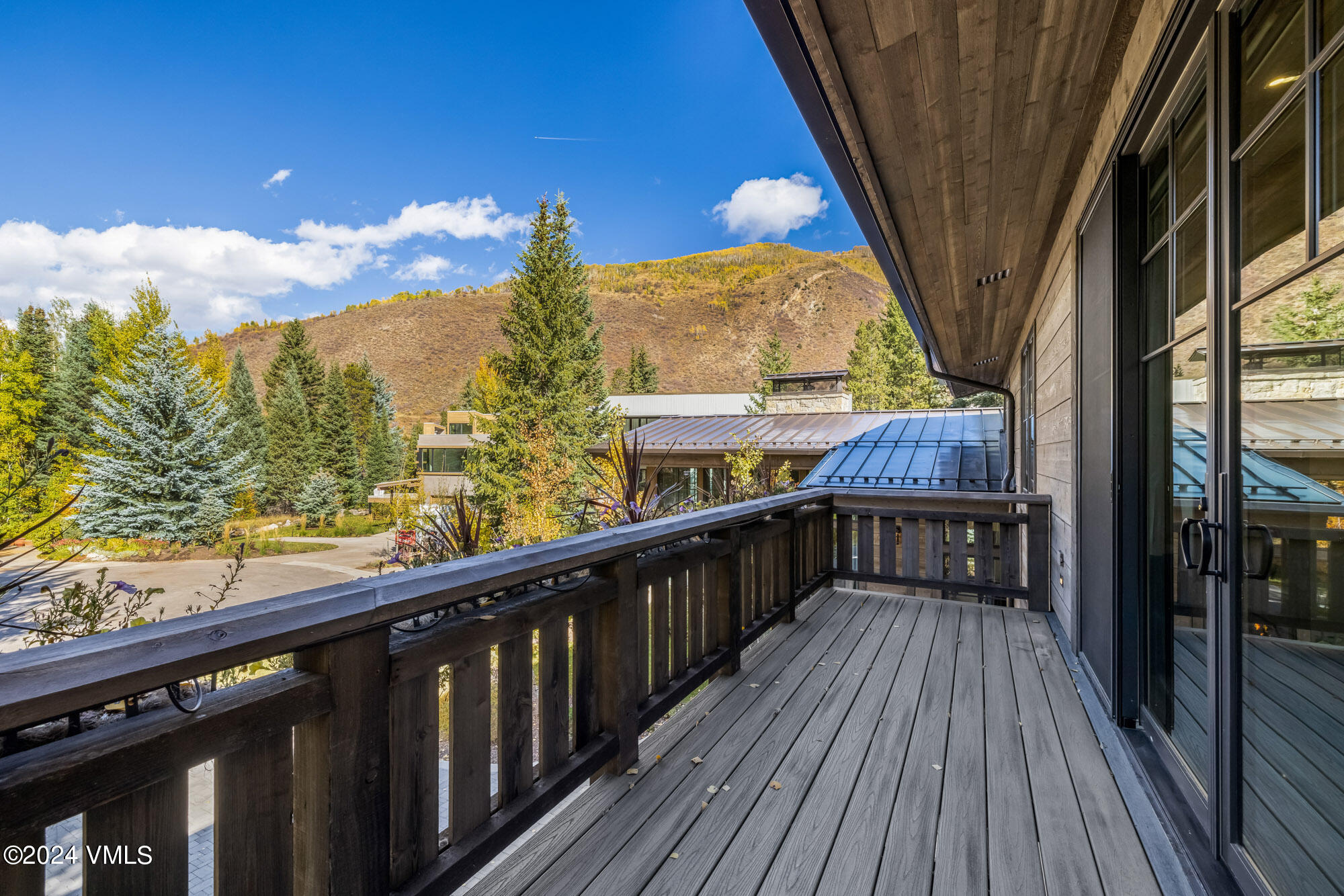 1022 Eagles Nest Circle Vail, CO 81657 - Photo 27 of 41 a view of balcony with wooden floor and outdoor seating