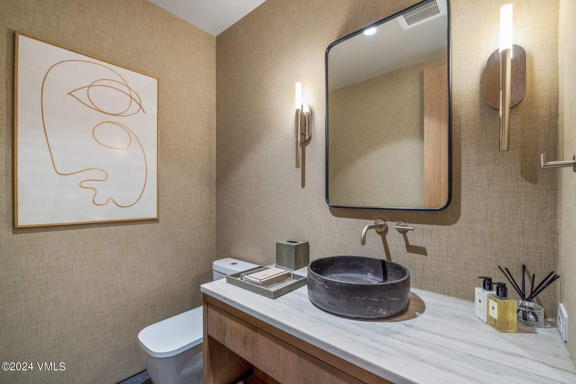 1022 Eagles Nest Circle Vail, CO 81657 - Photo 35 of 41 a bathroom with a toilet sink and mirror