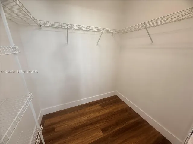 a view of a balcony with wooden floor