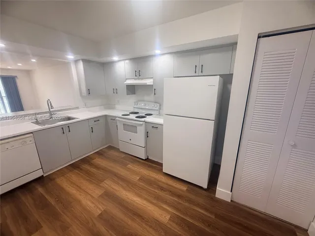 a view of room with wooden floor