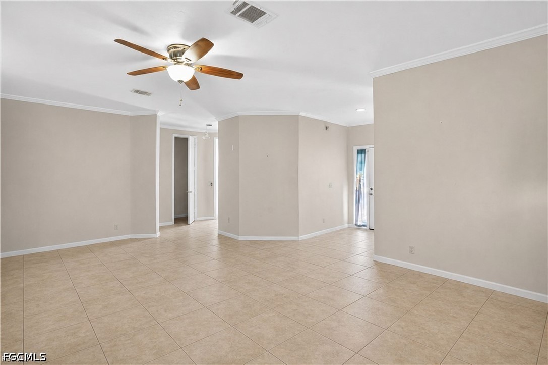 2808 34th Street Southwest Lehigh Acres, FL 33976 - Photo 3 of 14 an empty room with closet and fan