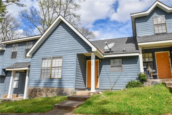 a front view of a house with a yard