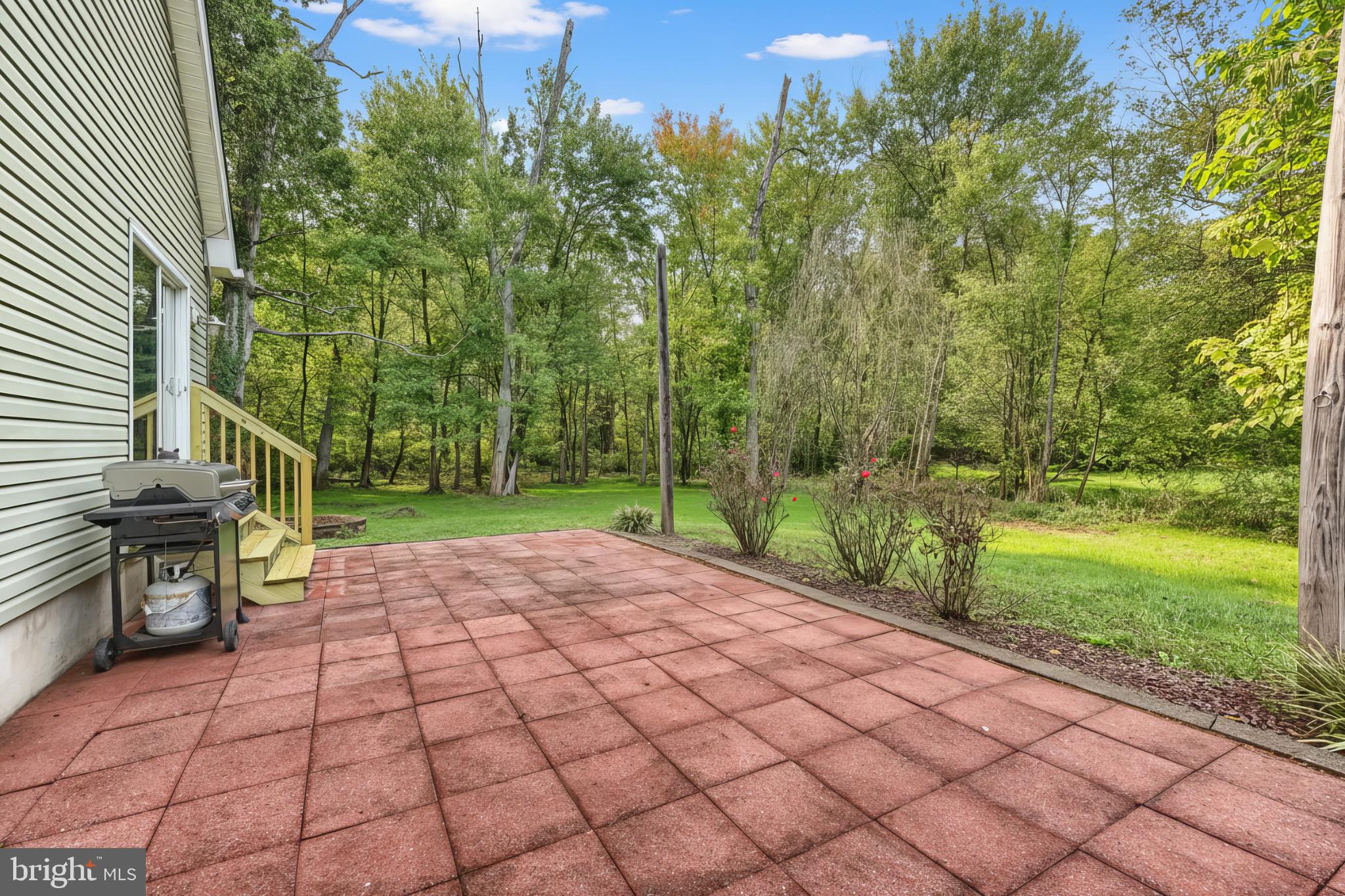 4105 Smith Road Dover, PA 17315 - Photo 5 of 28 Serene patio overlooking lush greenery.