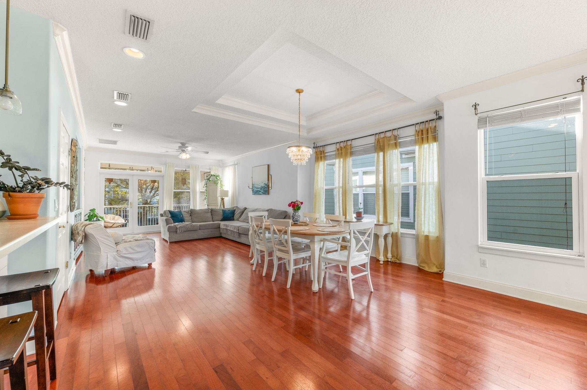 178 Sunset Circle North St. Augustine, FL 32080 - Photo 12 of 45 a living room with furniture a wooden floor and a large window