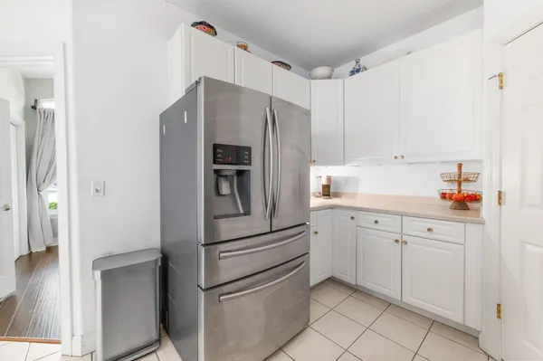 a kitchen with cabinets and stainless steel appliances
