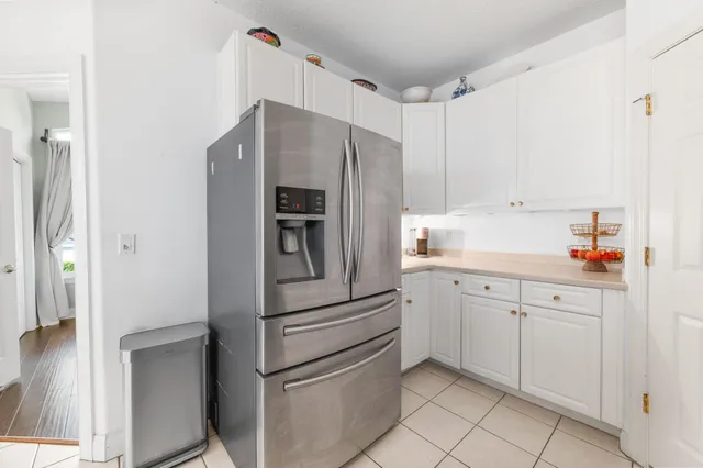 a kitchen with cabinets and stainless steel appliances
