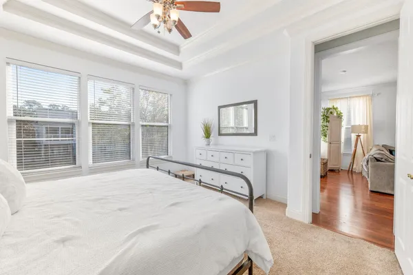 a bedroom with a large bed and a large window