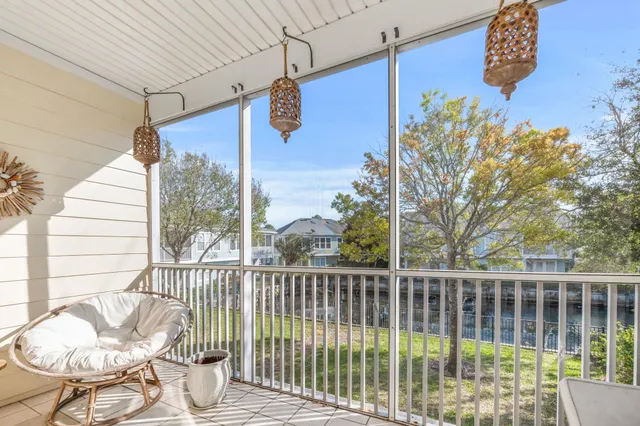 a view of a chair and table in the balcony