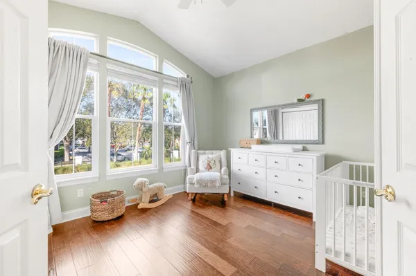 a bedroom with furniture and windows
