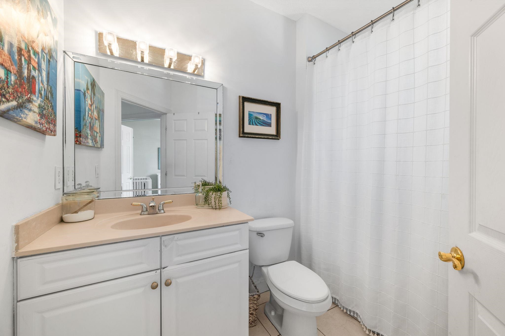 178 Sunset Circle North St. Augustine, FL 32080 - Photo 27 of 45 a bathroom with a granite countertop sink and a mirror
