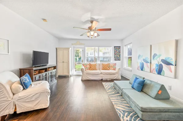 a living room with furniture and a flat screen tv