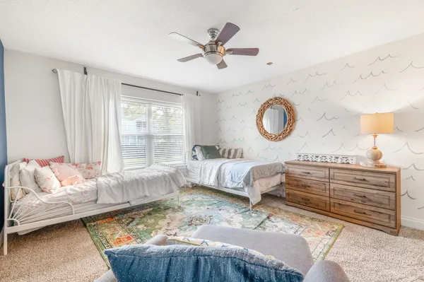 a bedroom with a bed and window