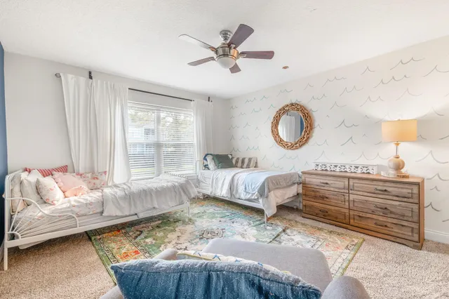 a bedroom with a bed and window