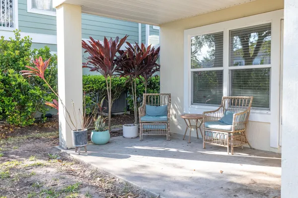 a outdoor living space with furniture and a potted plant