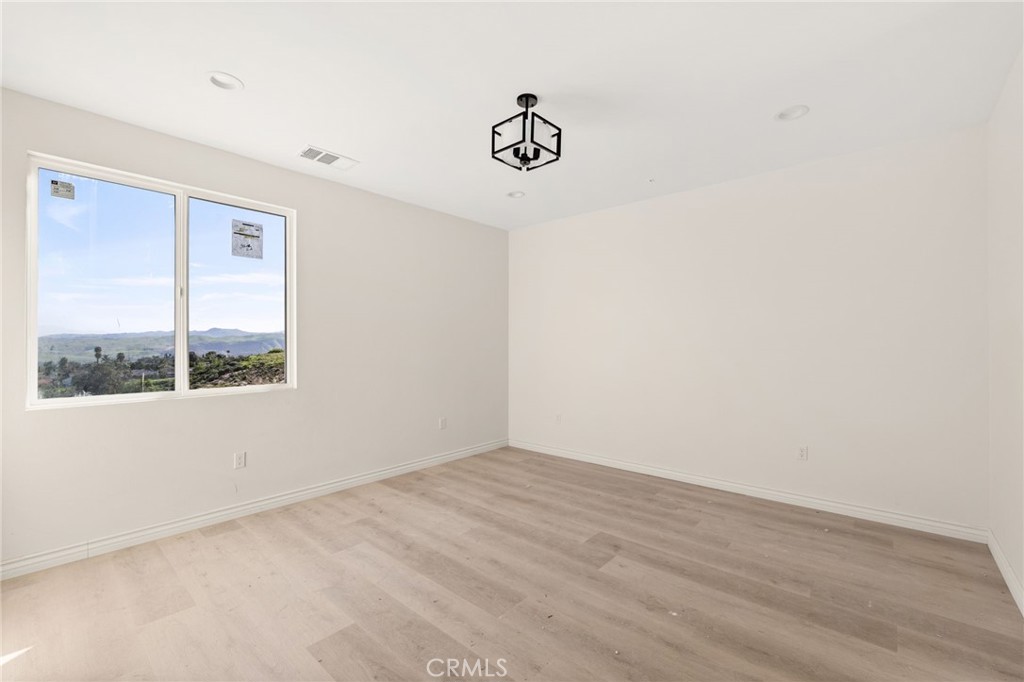 3260 Howe Street Corona, CA 92881 - Photo 12 of 28 an empty room with a window