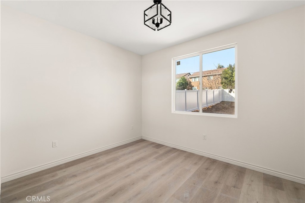 3260 Howe Street Corona, CA 92881 - Photo 21 of 28 a view of empty room with window and ceiling fan
