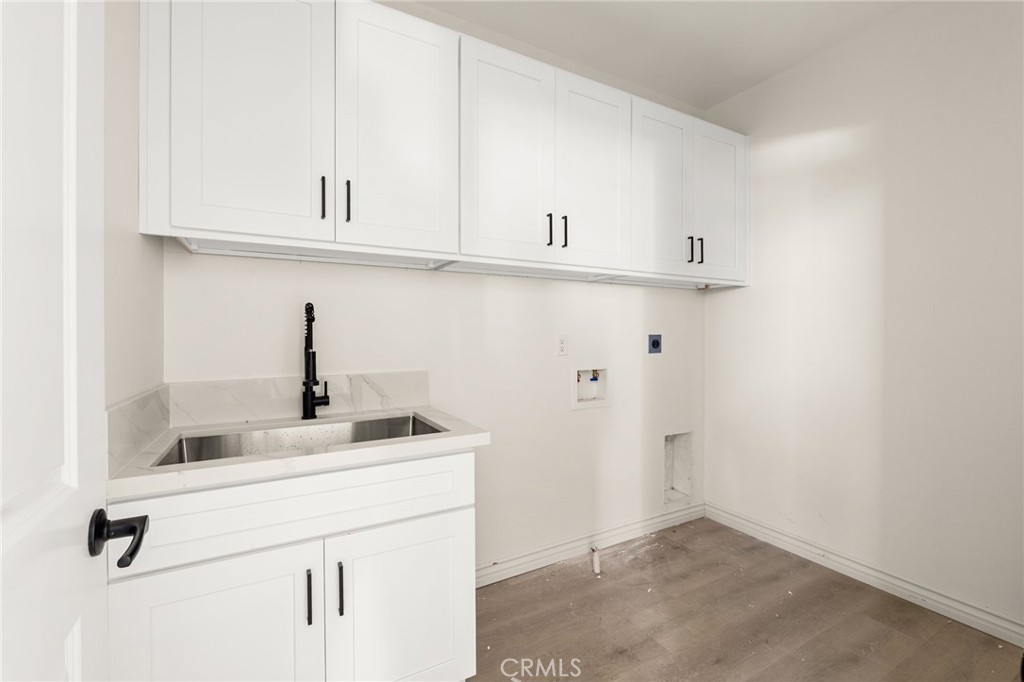 3260 Howe Street Corona, CA 92881 - Photo 22 of 28 a kitchen with stainless steel appliances granite countertop white cabinets and a sink