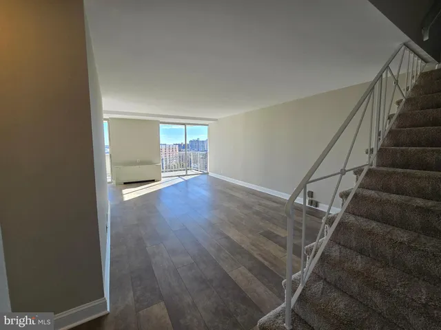 a view of entryway with wooden floor
