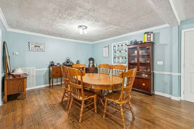 a dinning table and chairs in a room