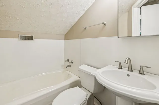 a view of a yard with a tree