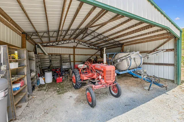 a view of empty room with trees in the background