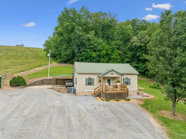 a backyard of a house with lots of green space