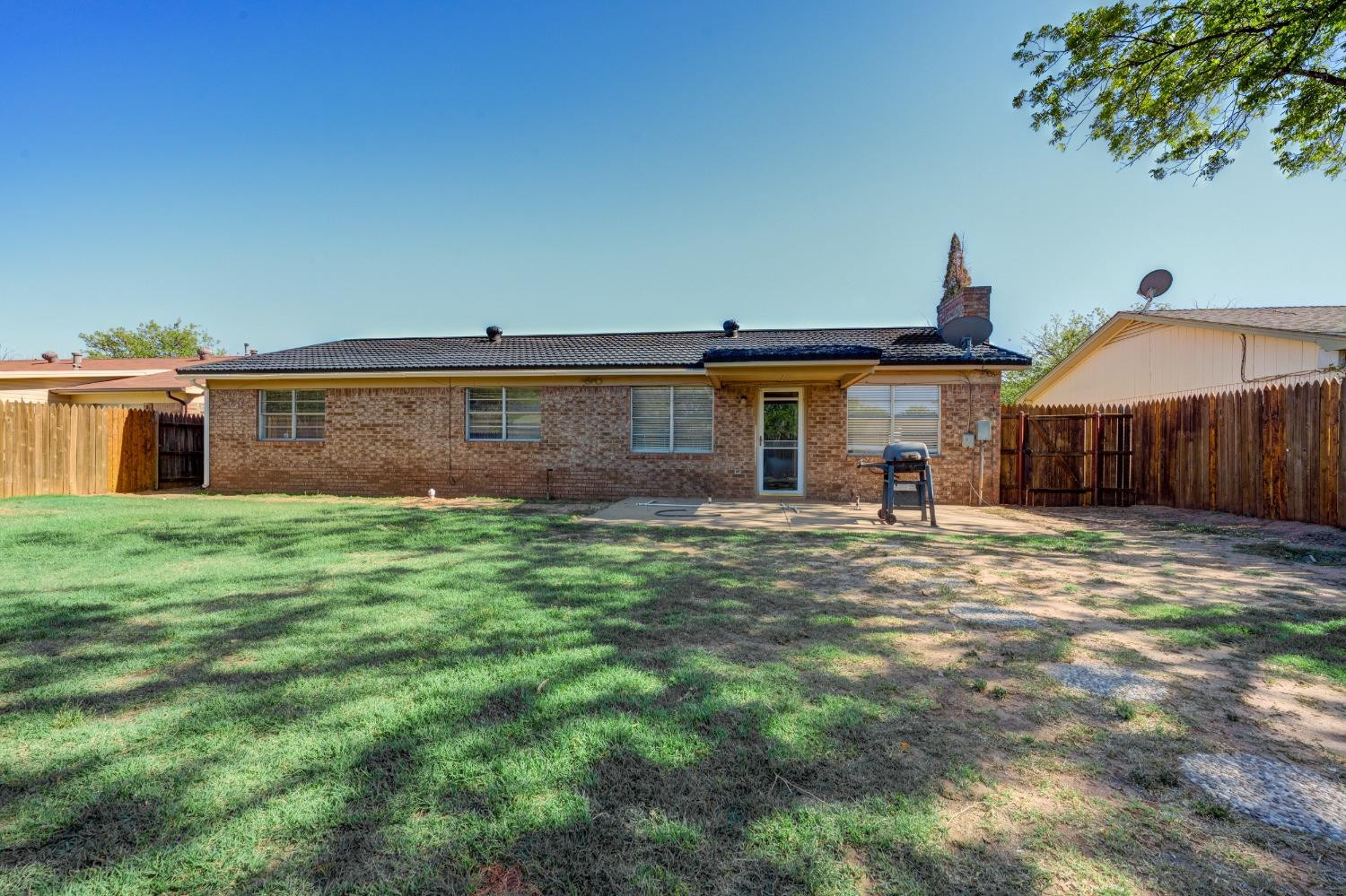 2314 79th Street Lubbock, TX 79423 - Photo 33 of 33 a front view of a house with a yard