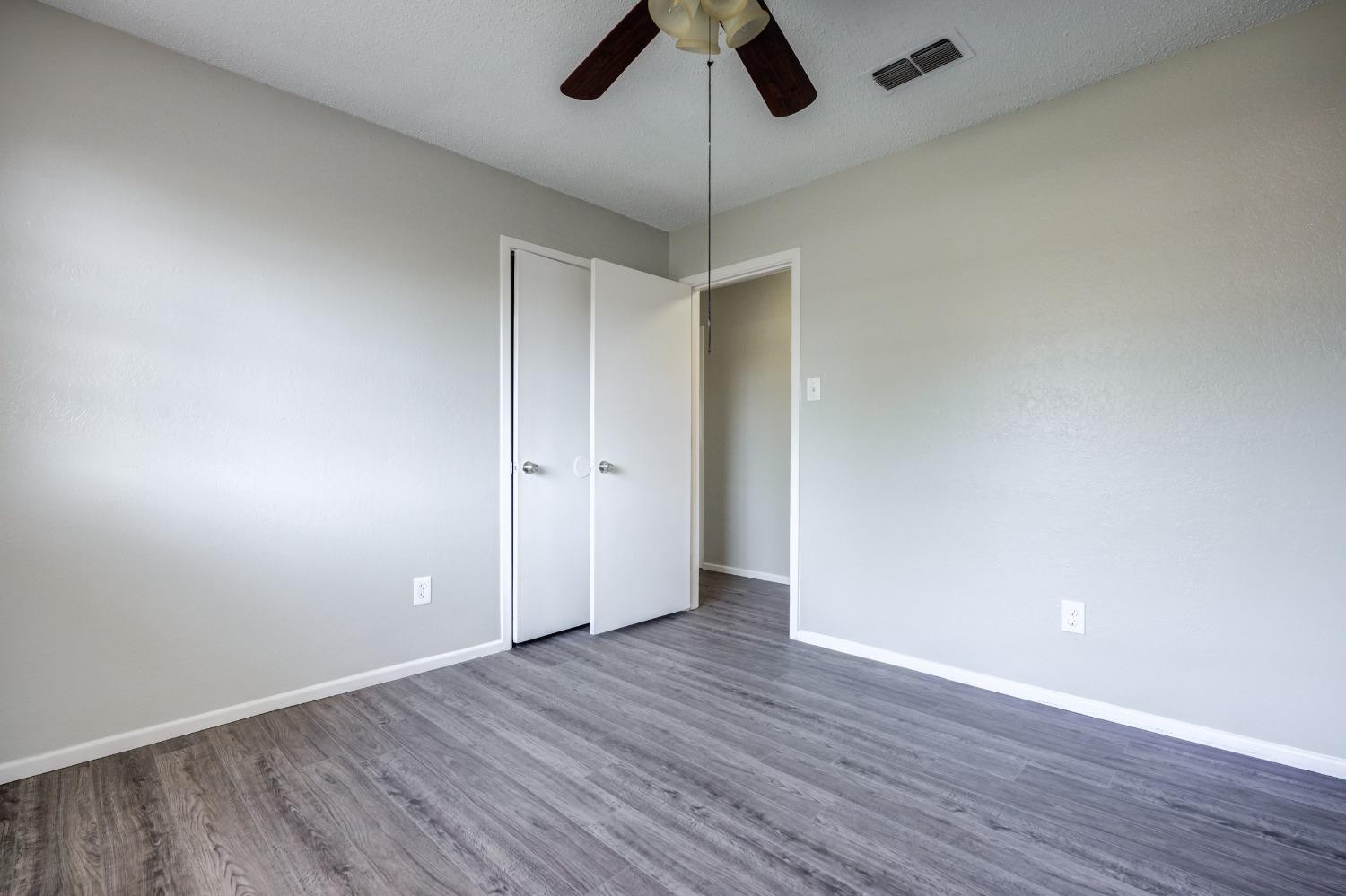 2314 79th Street Lubbock, TX 79423 - Photo 7 of 33 wooden floor in an empty room