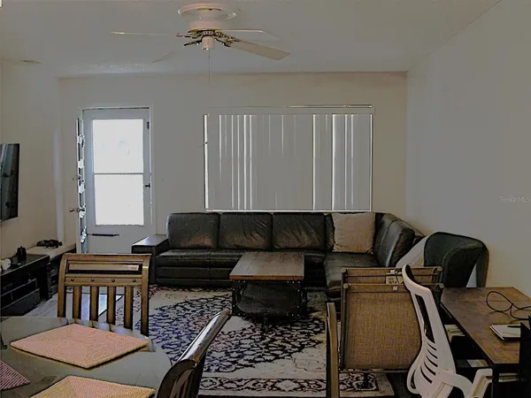 a living room with furniture and a window