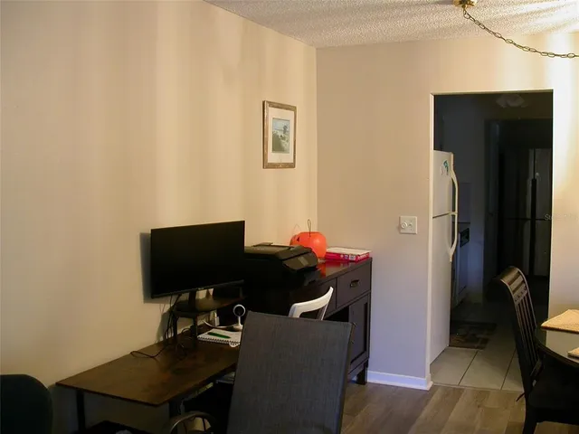 a kitchen with a sink and a refrigerator