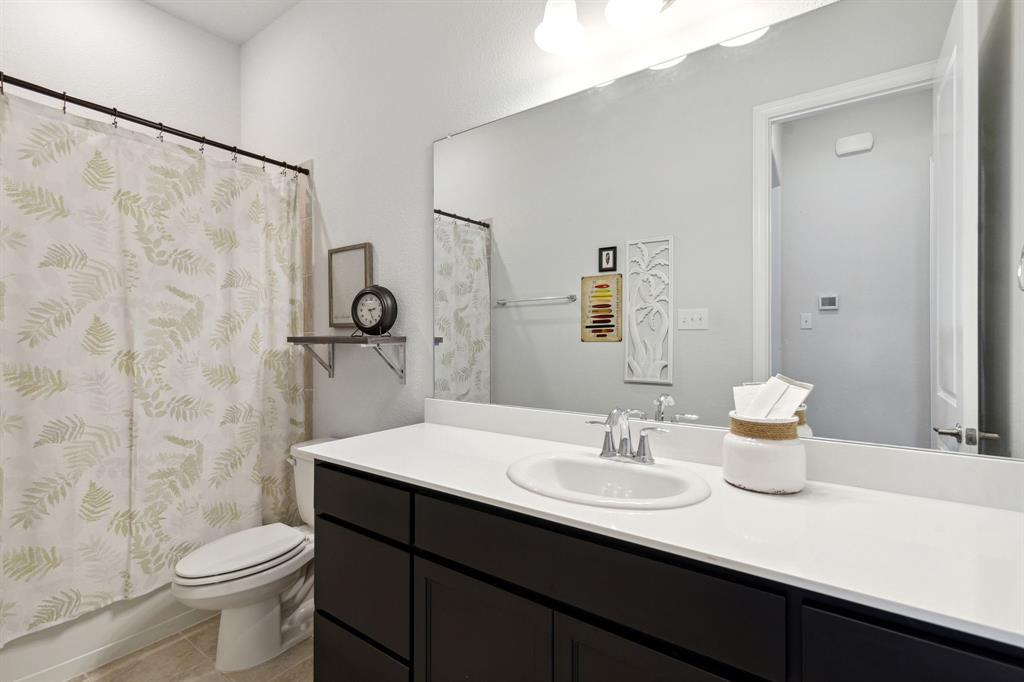 18142 Lakefront Court Forney, TX 75126 - Photo 11 of 26 a bathroom with a sink toilet and shower