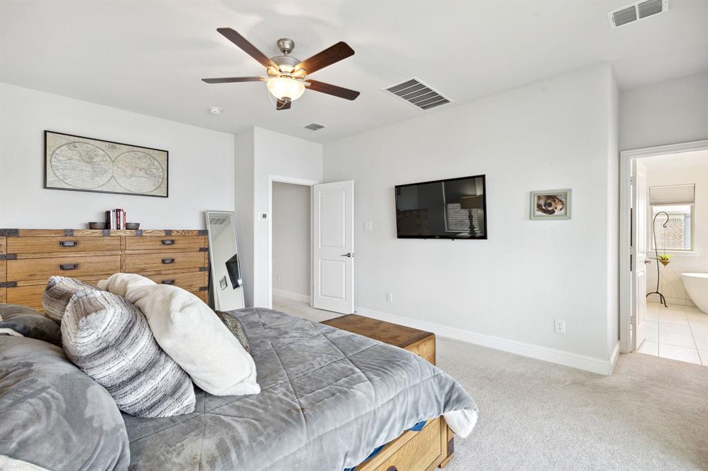 18142 Lakefront Court Forney, TX 75126 - Photo 20 of 26 a living room with furniture and a flat screen tv