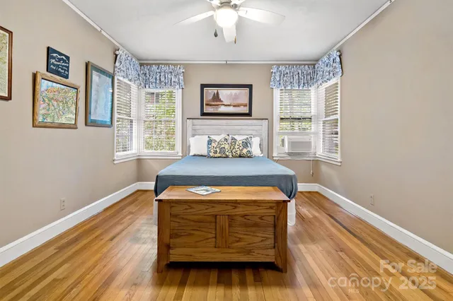 a bedroom with bed and a table