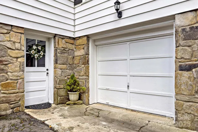 a view of a patio with a table and chairs